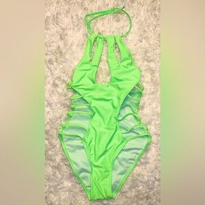 Neon green one piece swimsuit with side cutouts. Size Medium. New withou…